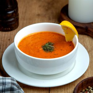 Lentil Soup Garnished with Lemon Slice.