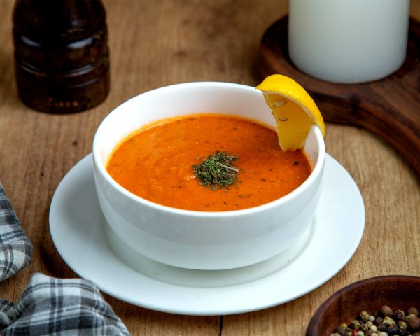 Lentil Soup Garnished with Lemon Slice.