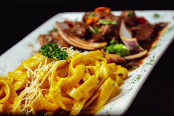 Pasta with Cheese Sauce and fried Meat.